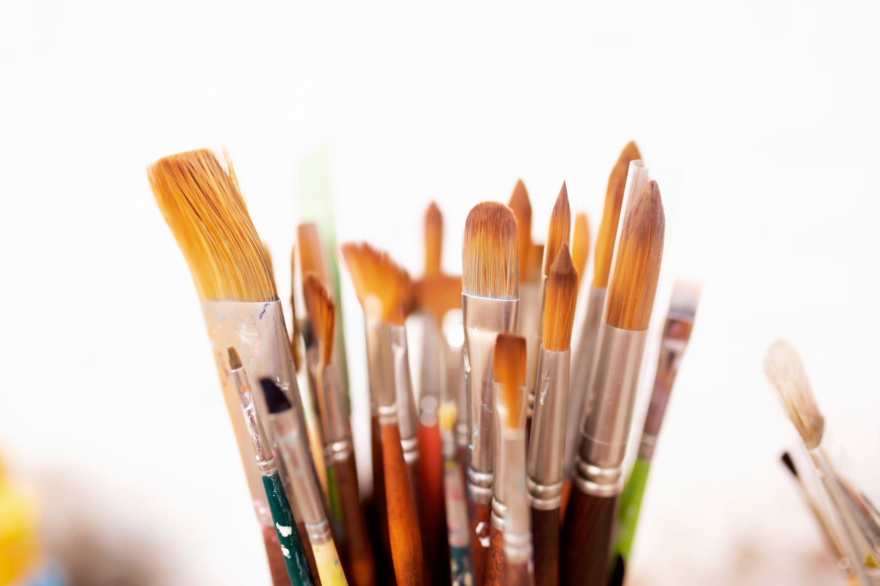 Paint brushes and colours laid out for a spiritual painting class